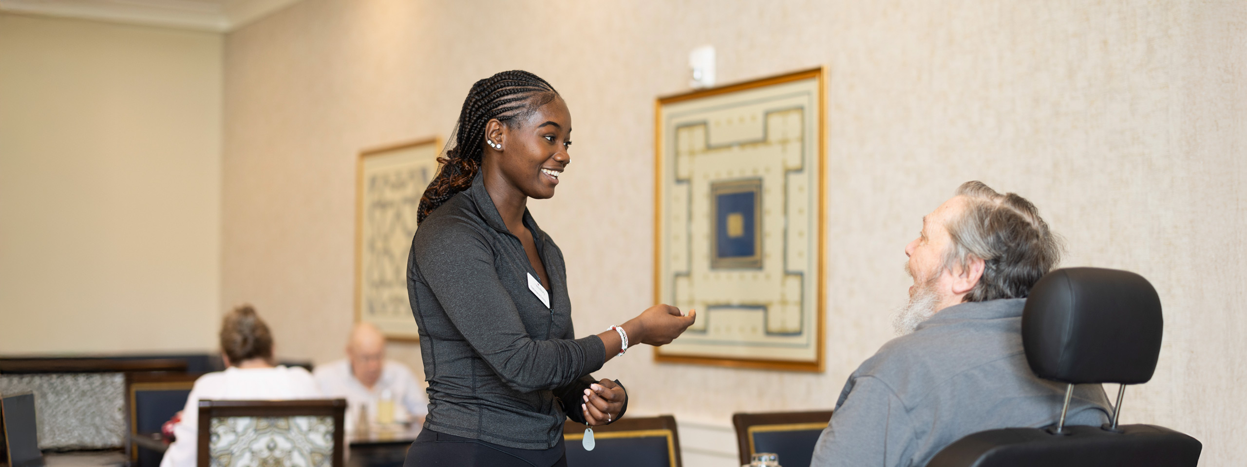 Staff member interacting with a resident in a common area
