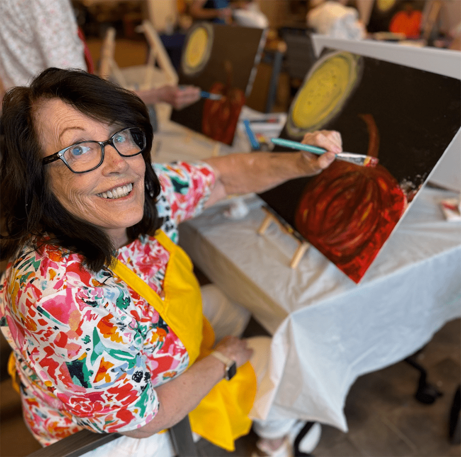Resident painting during an art activity