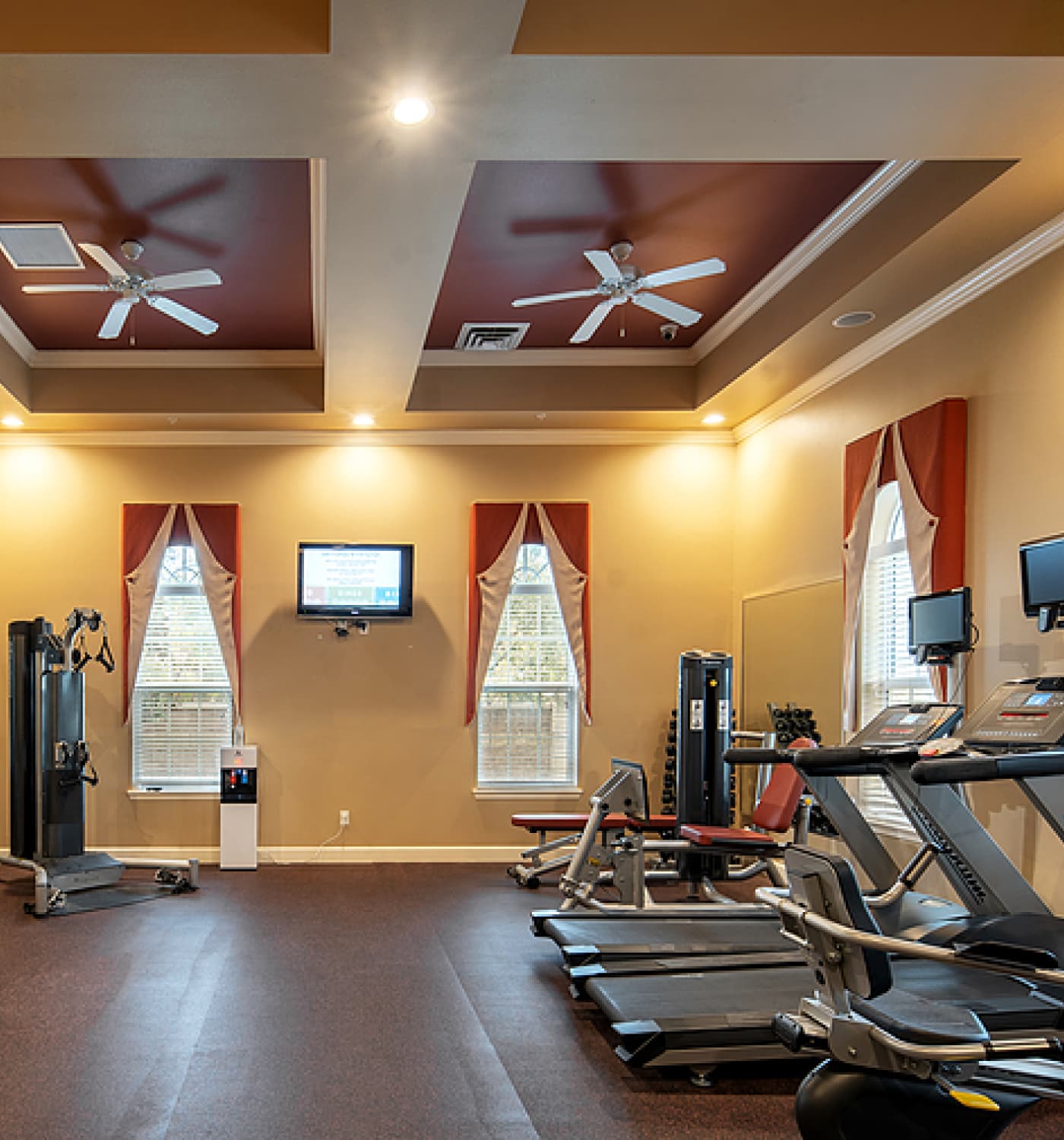 Well-equipped fitness room with exercise machines