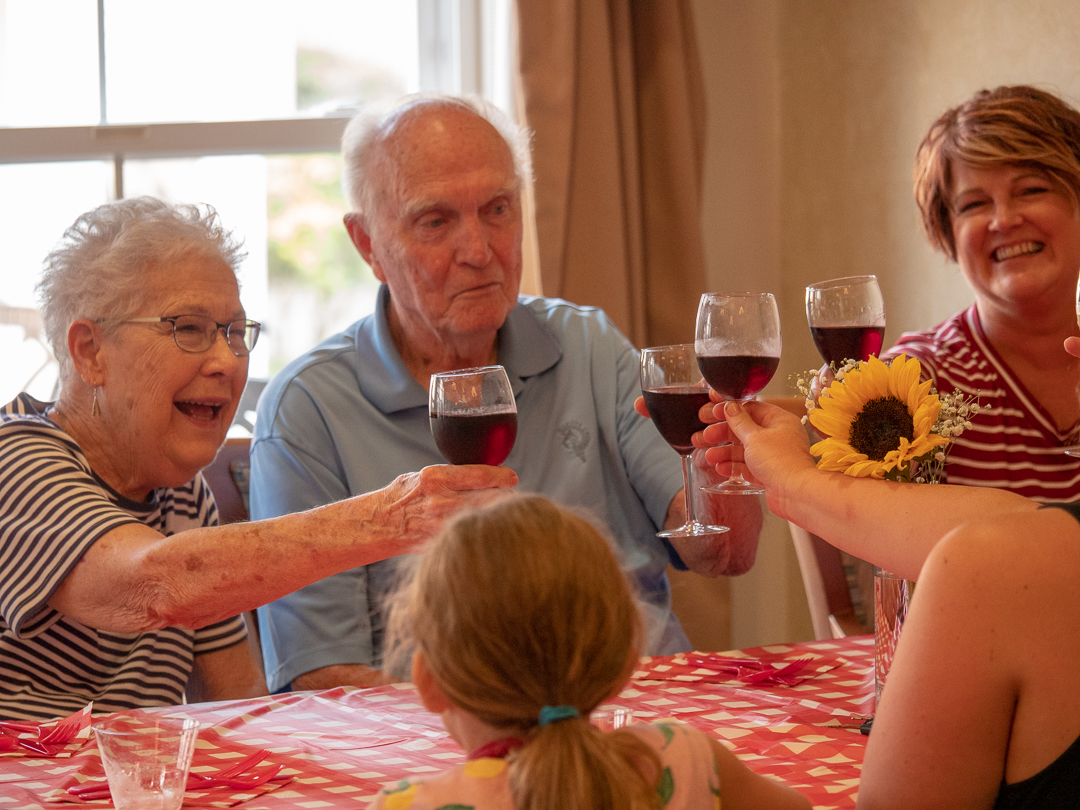 Residents toasting during a social gathering