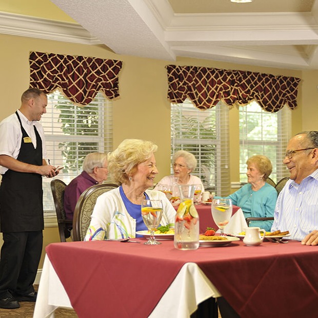 Residents enjoying a meal in the dining room
