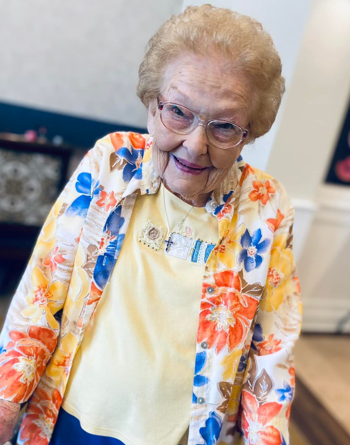 Cheerful resident posing in a colorful shirt