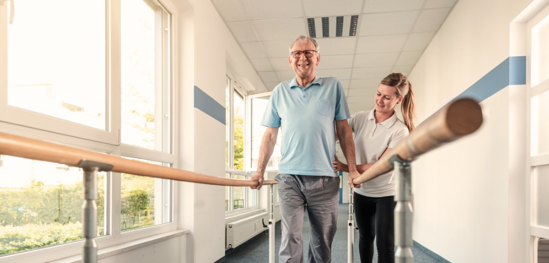 Therapist assisting resident during rehabilitation