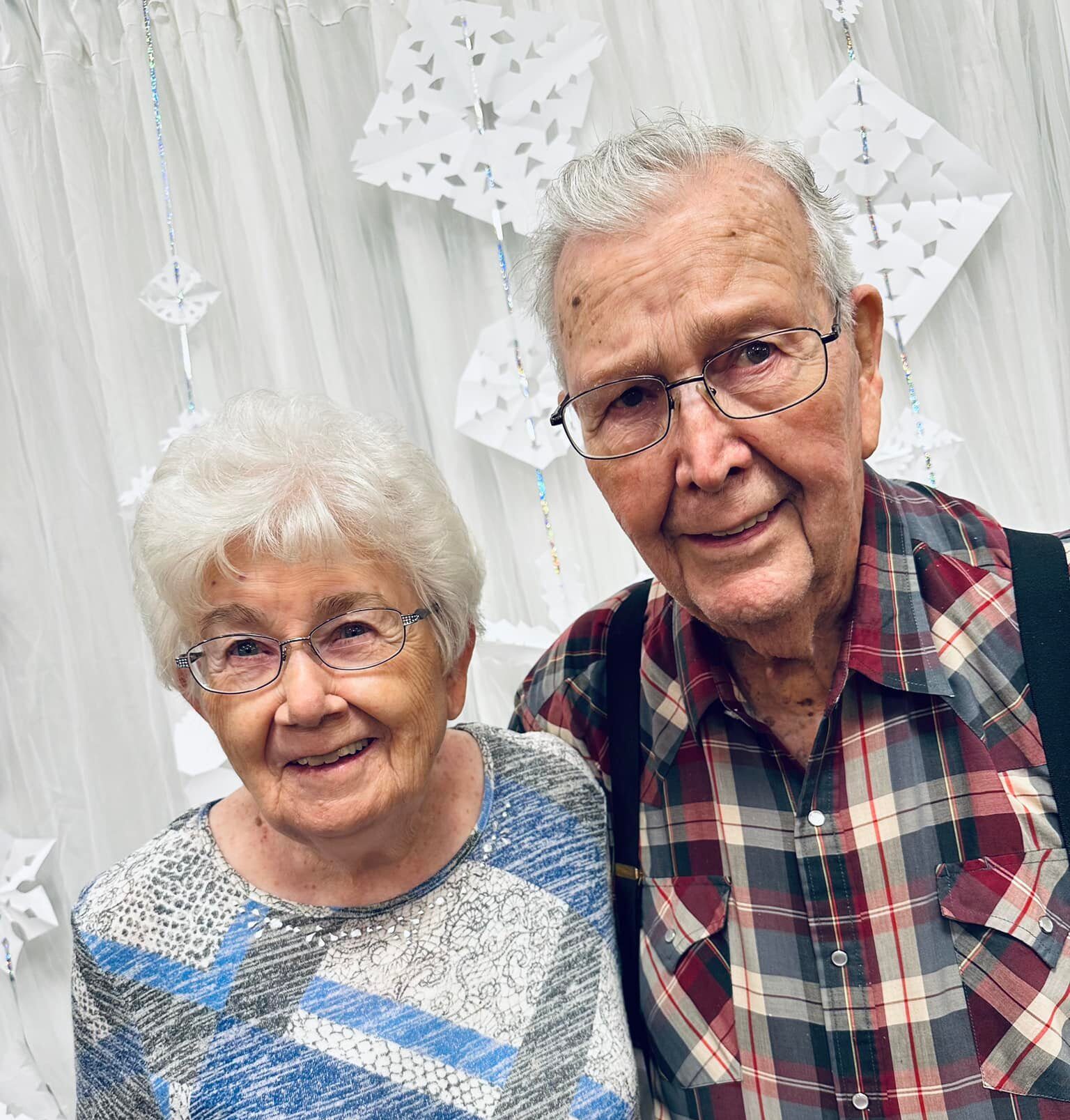 Smiling elderly couple posing for a photo