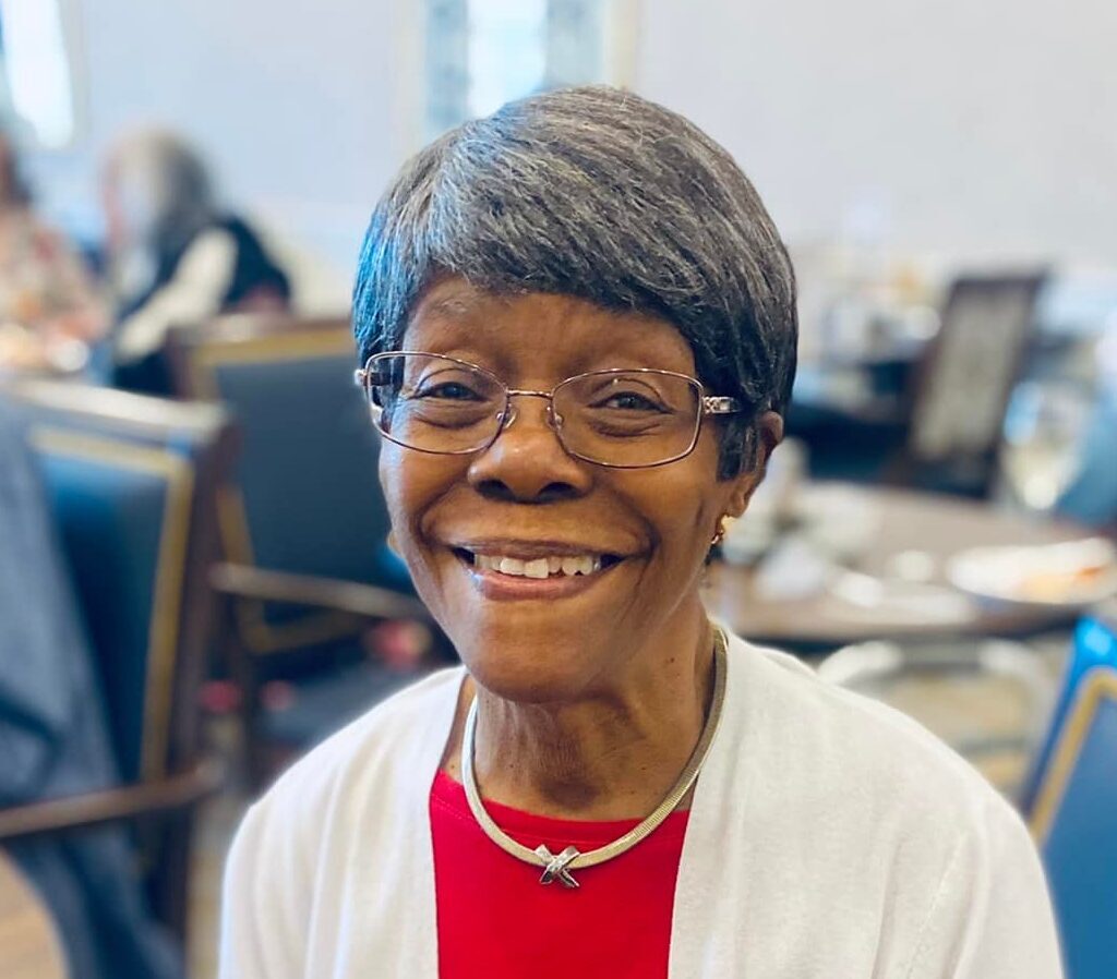 Smiling resident in a social setting