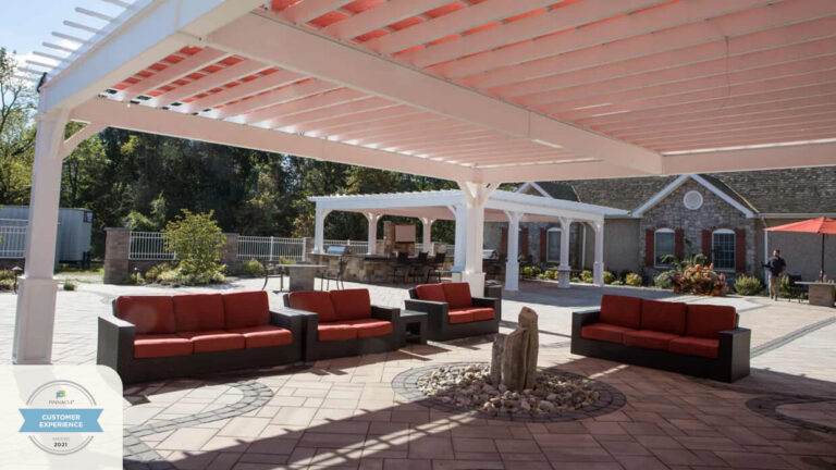 Outdoor seating area with lounge chairs and trees