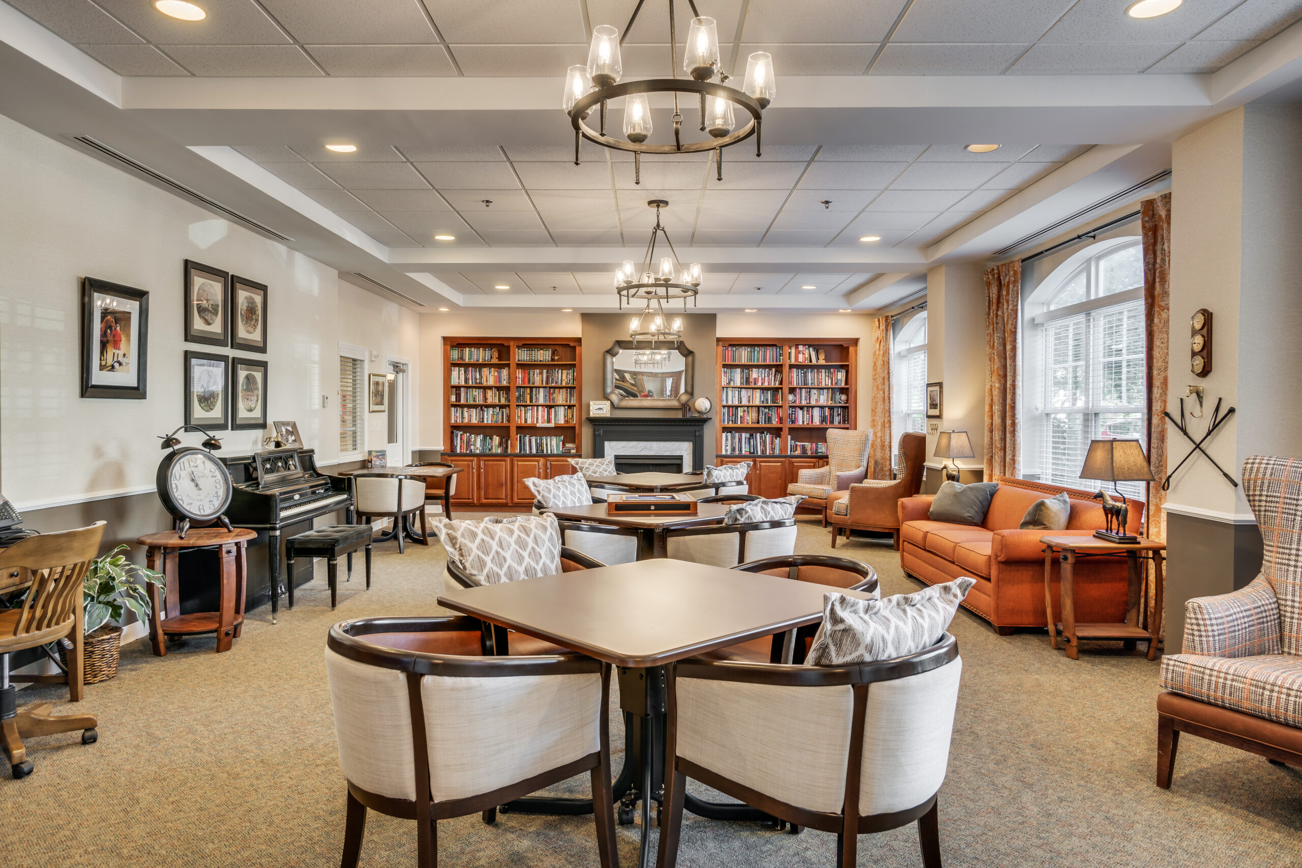 Bright common area with seating and bookshelves