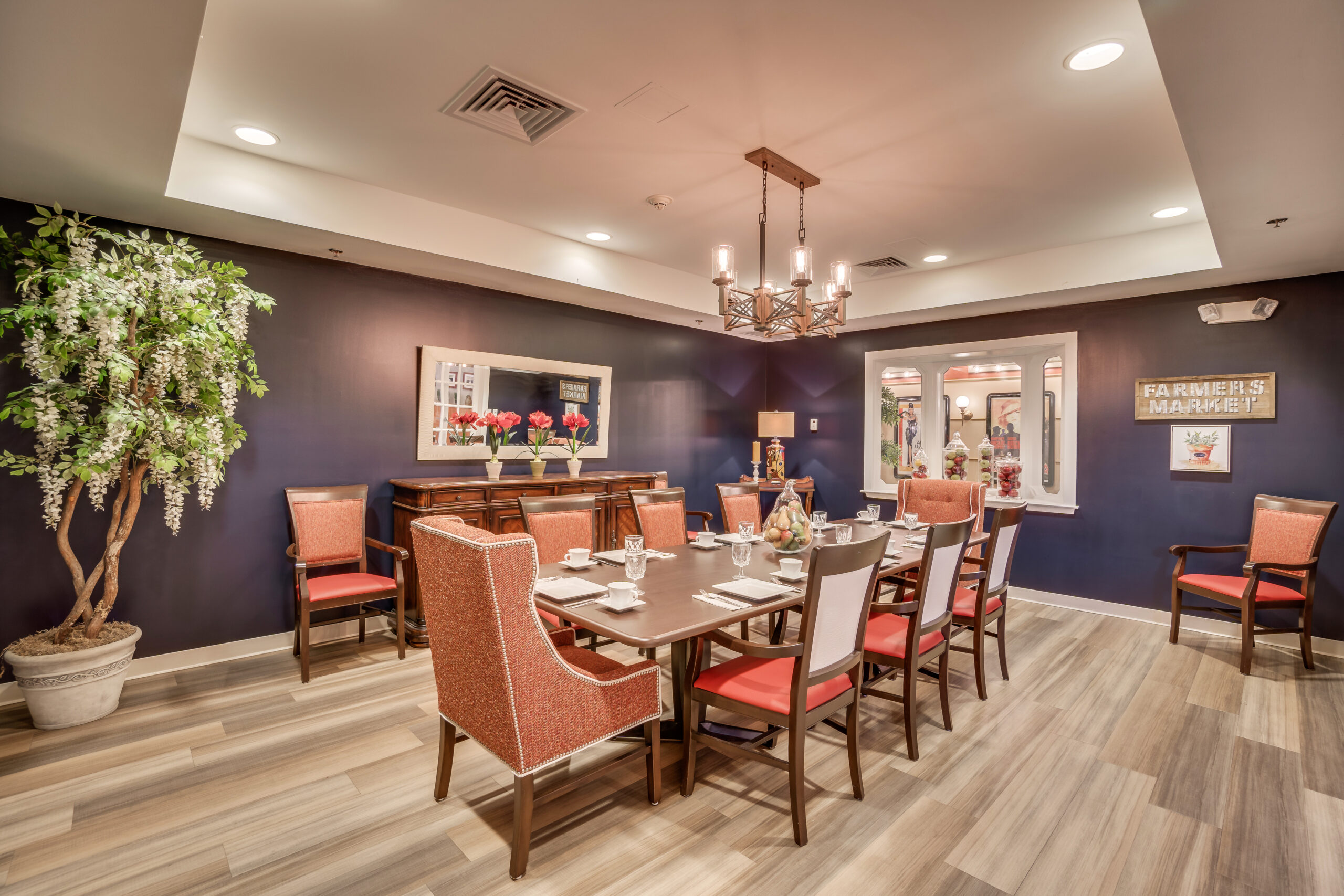 Bright dining room with table set for meals