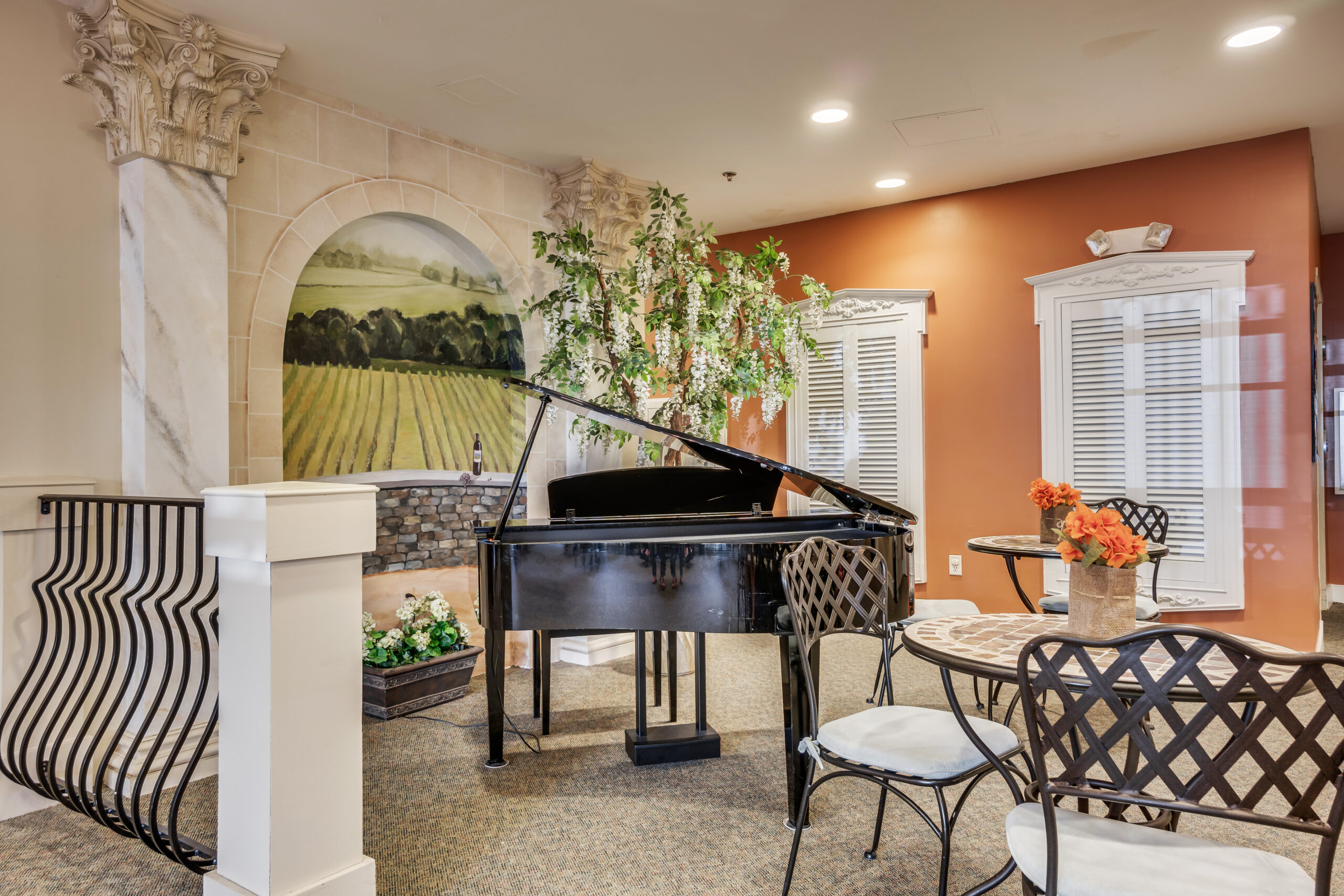 Interior common area with a grand piano and seating