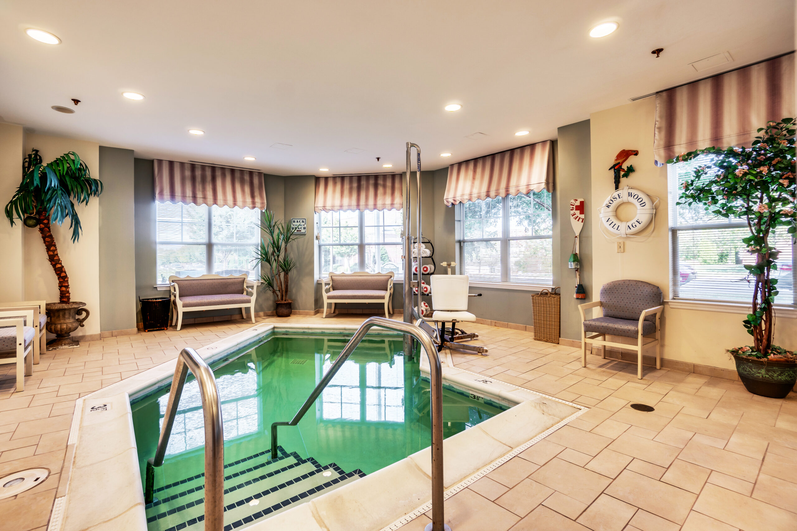 Indoor hot tub area with comfortable seating