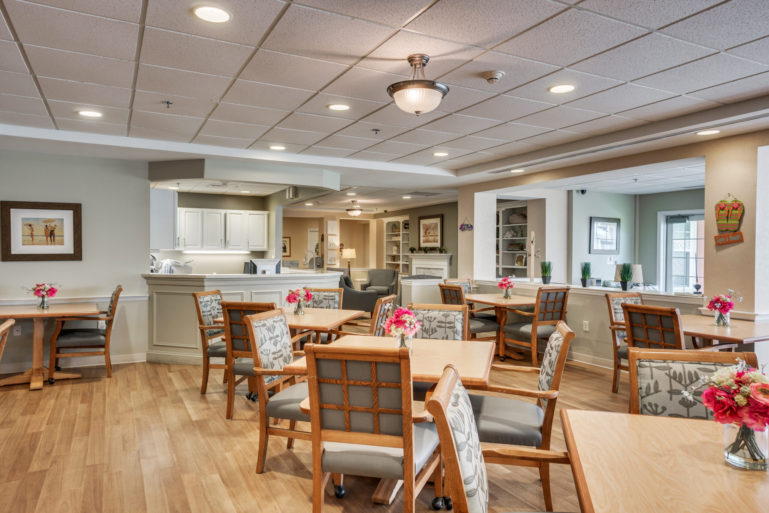 Common area with seating and floral centerpieces