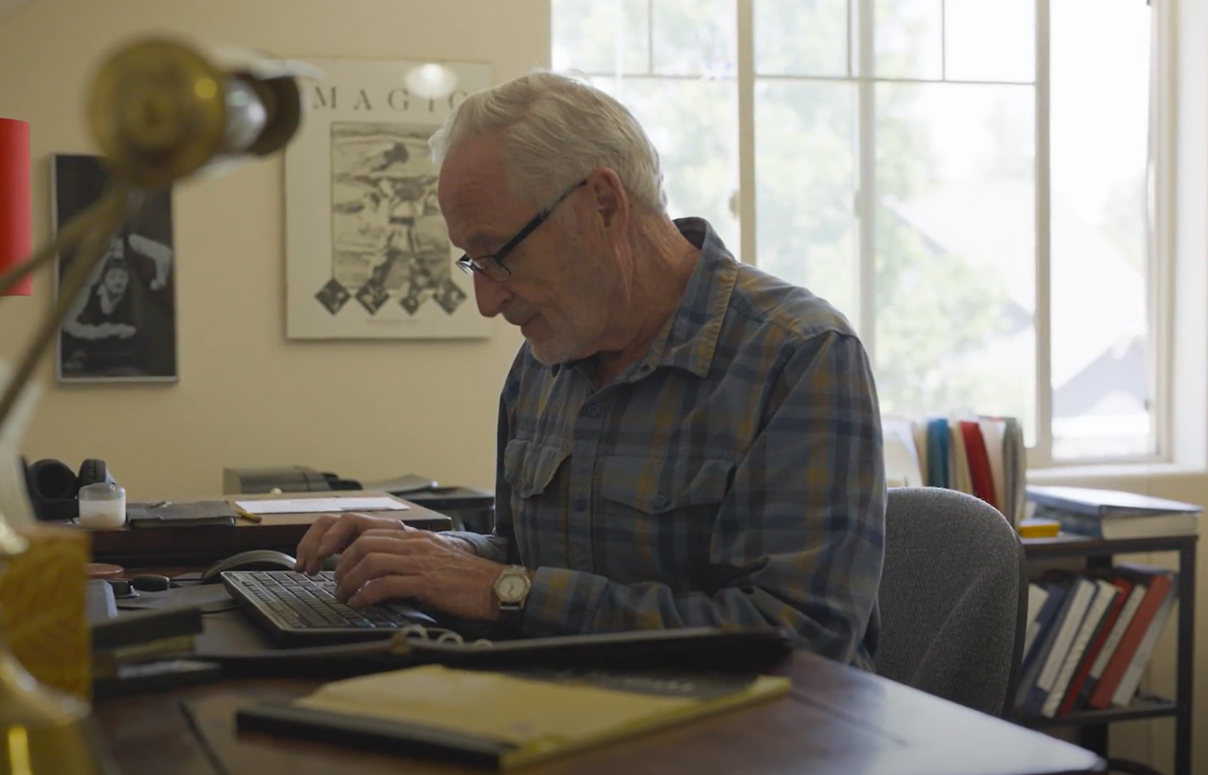 Resident working at a desk in a well-lit room