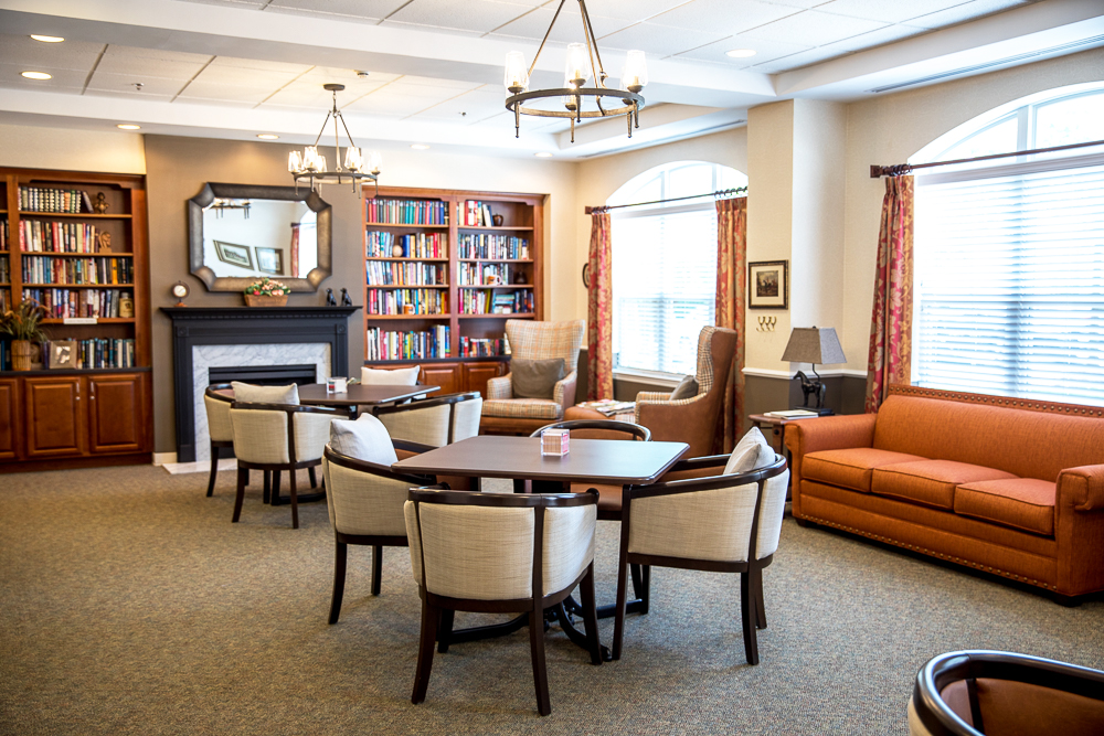 Cozy common area with bookshelves and seating