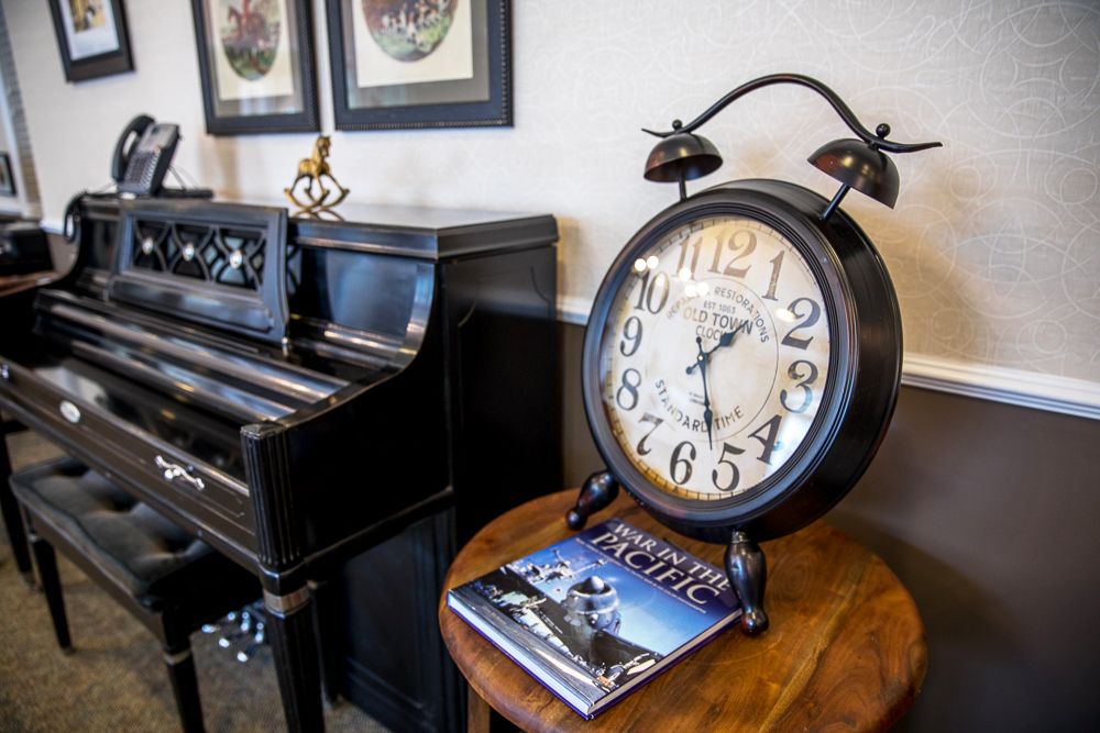 Decorative clock and a book in a common area