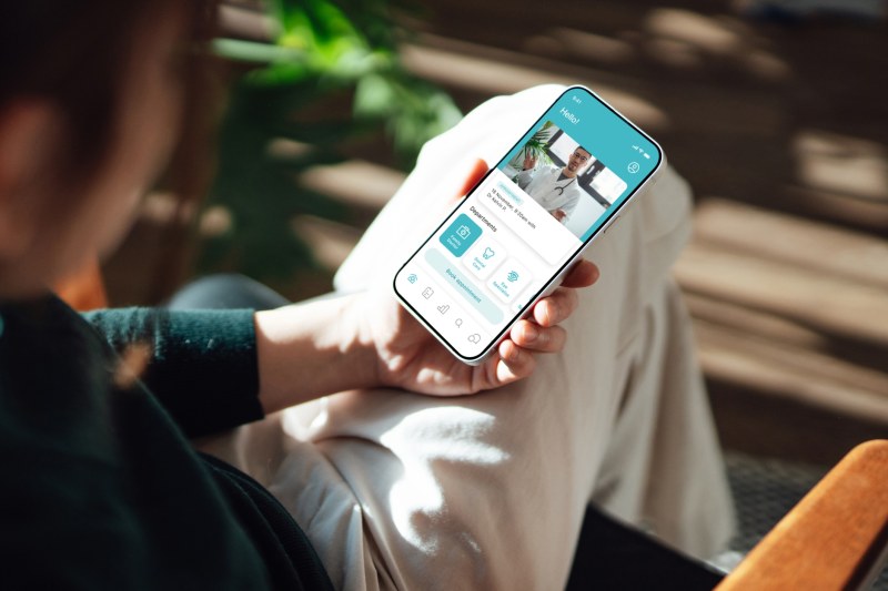 Person using a mobile app for senior living services
