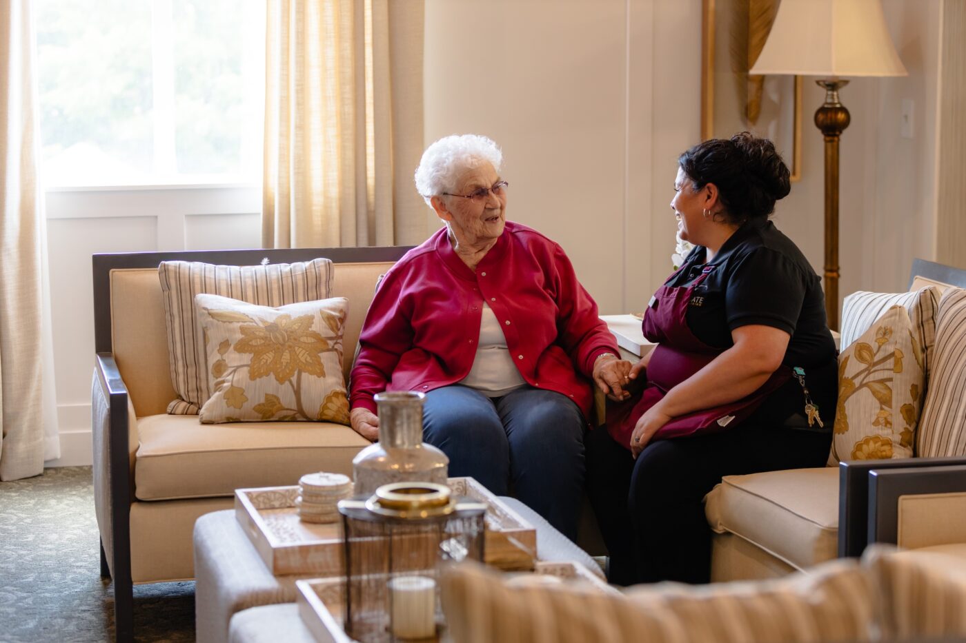 Staff member chatting with a resident in a common area