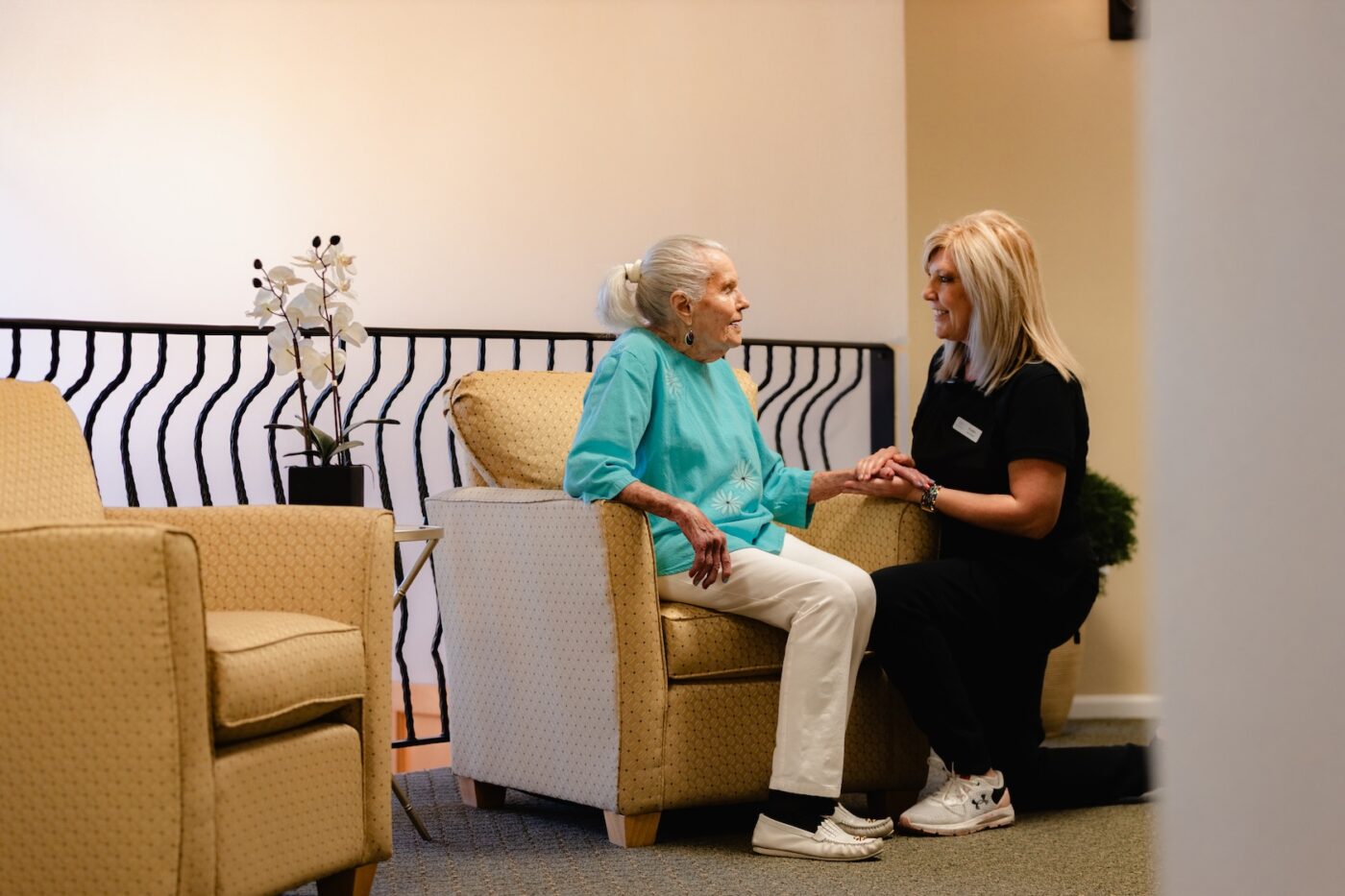 Staff member conversing with a resident in a common area
