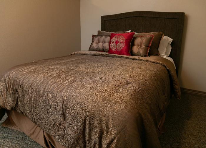 Cozy bedroom with a decorated bed and pillows
