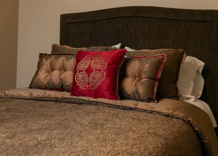 Cozy bedroom setup with decorative pillows