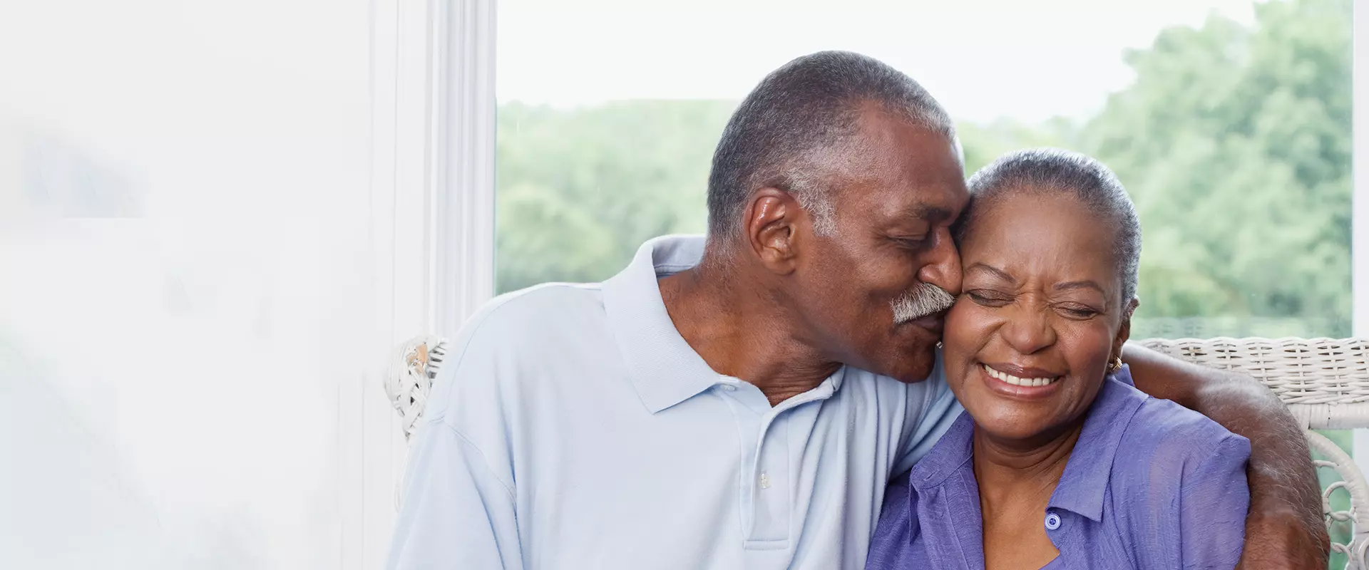 A senior couple enjoying a loving moment together
