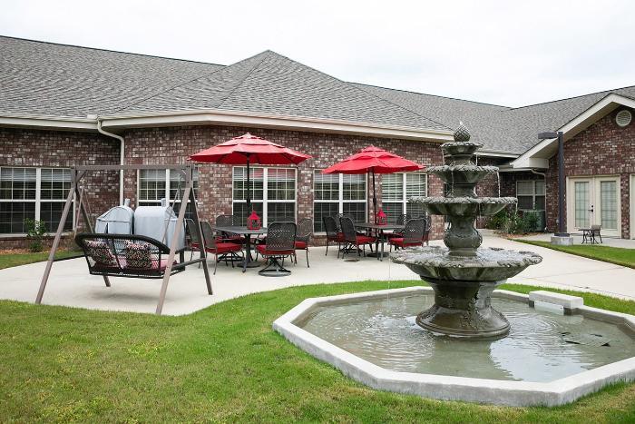 Outdoor seating area with a fountain and umbrellas
