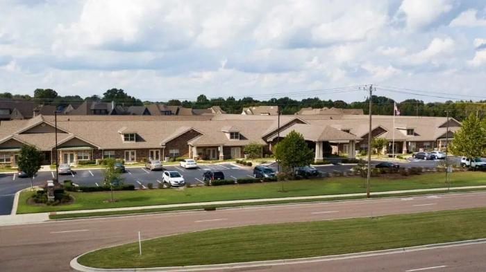 Aerial view of the assisted living facility grounds and parking area