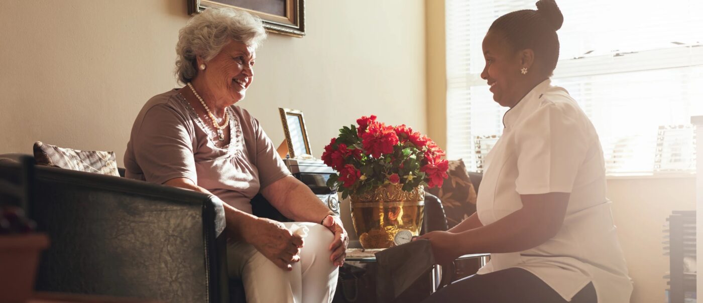 A resident and staff member engaging in conversation