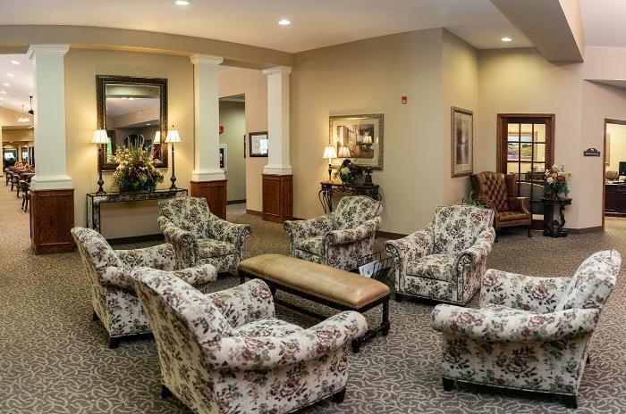 Interior seating area with floral-patterned chairs