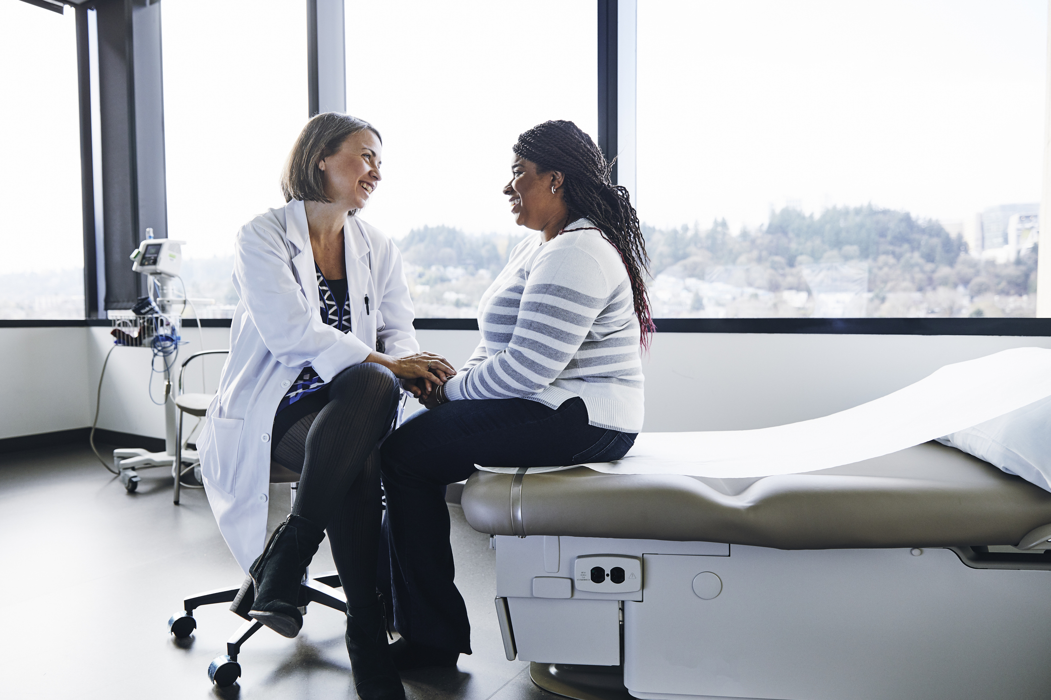 Healthcare professional talking with a resident in a facility room