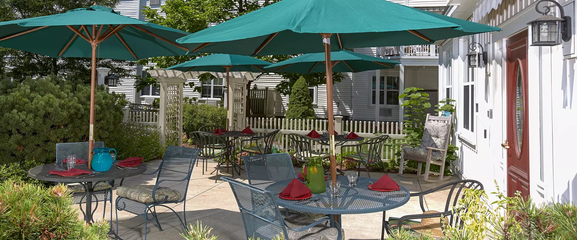 Outdoor patio area with tables and umbrellas