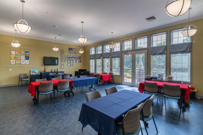Bright common area with decorated tables and large windows