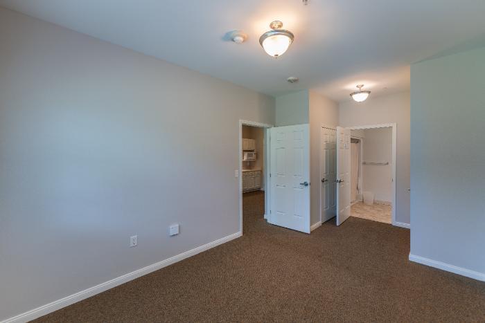A private resident room with light-colored walls
