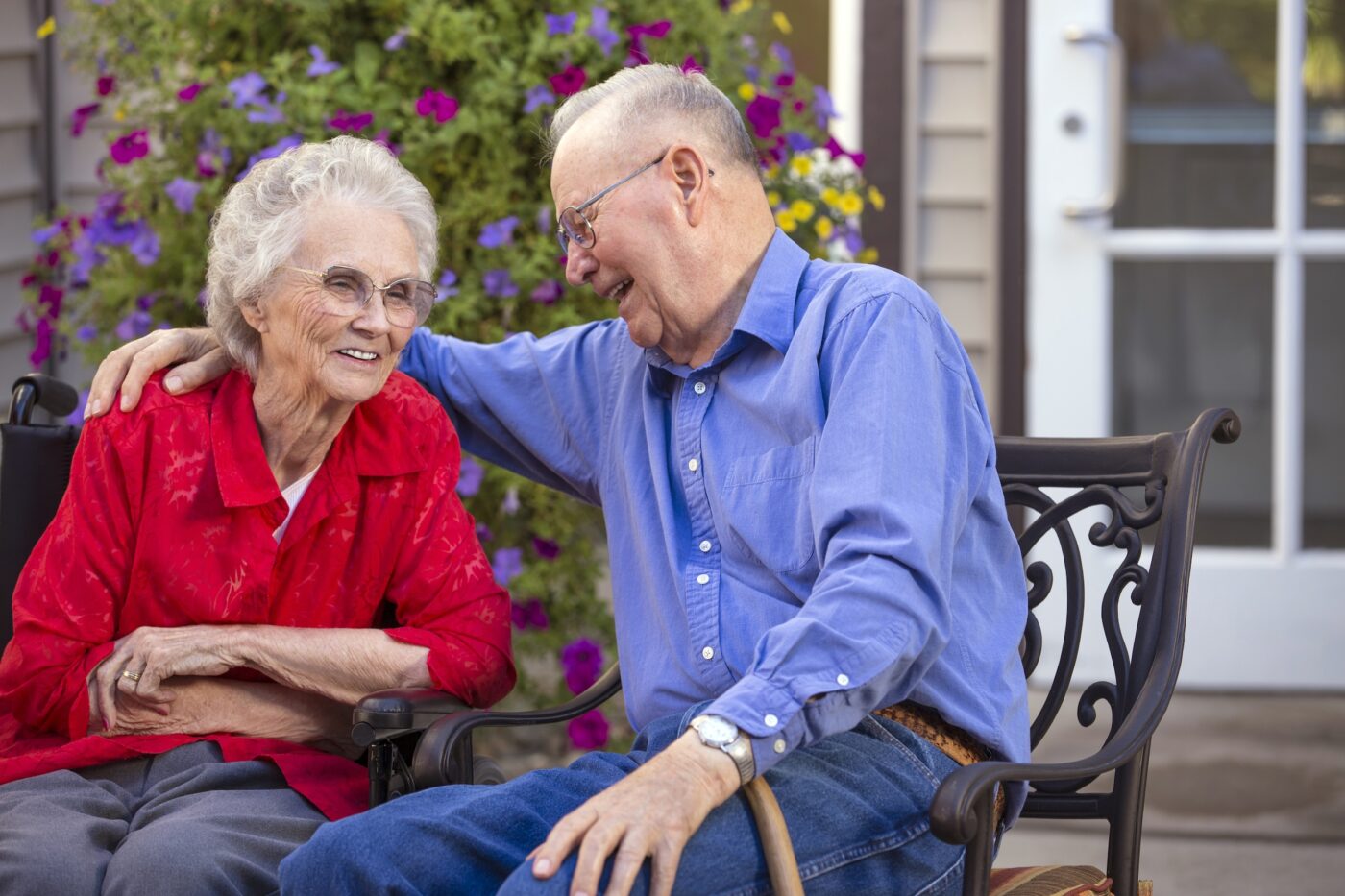 Two residents enjoying a conversation outside