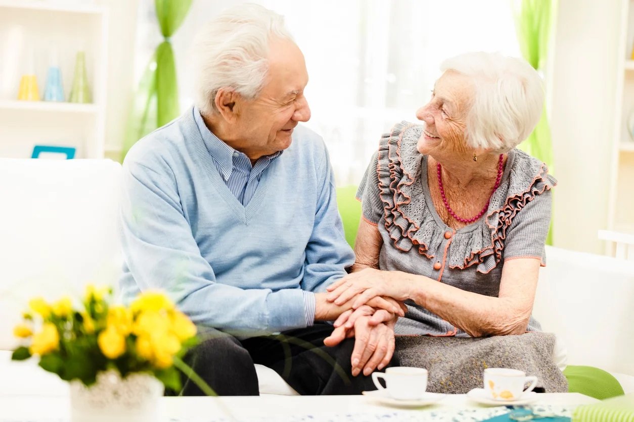Elderly couple enjoying a warm moment together indoors