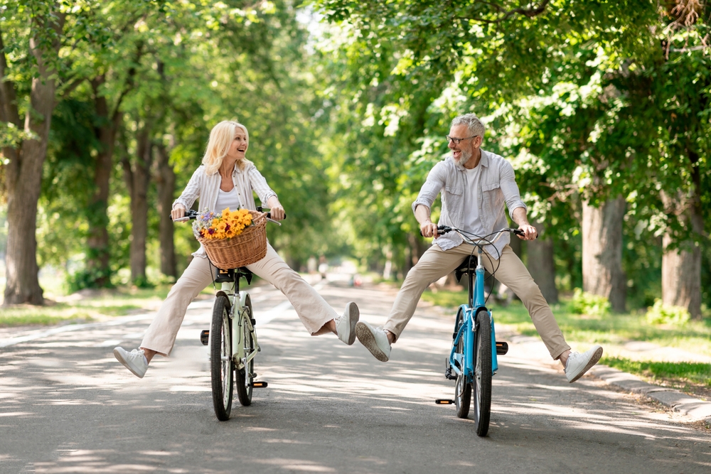 Active seniors biking together in a park