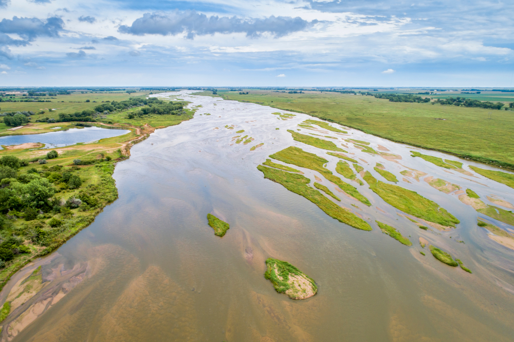Aerial view of a river winding through green landscape