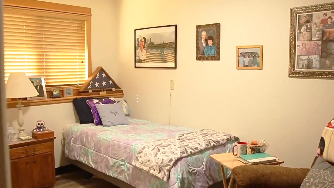 Cozy bedroom with personal decor and bed