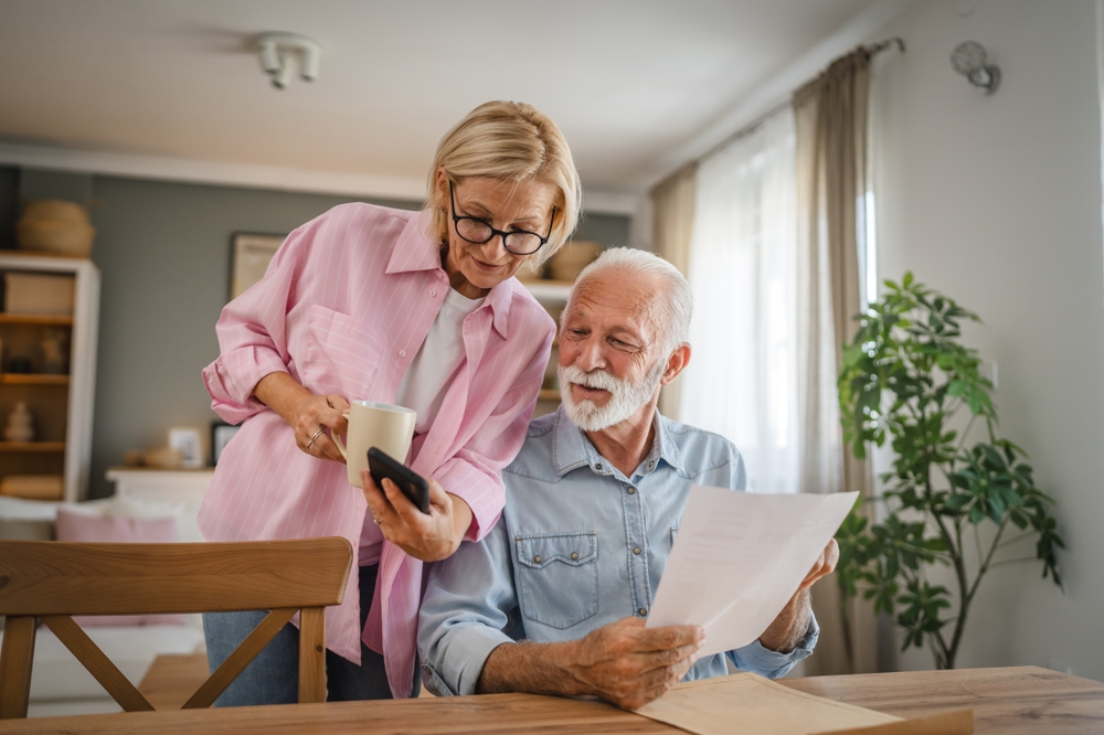 A senior couple engaging in conversation at a table