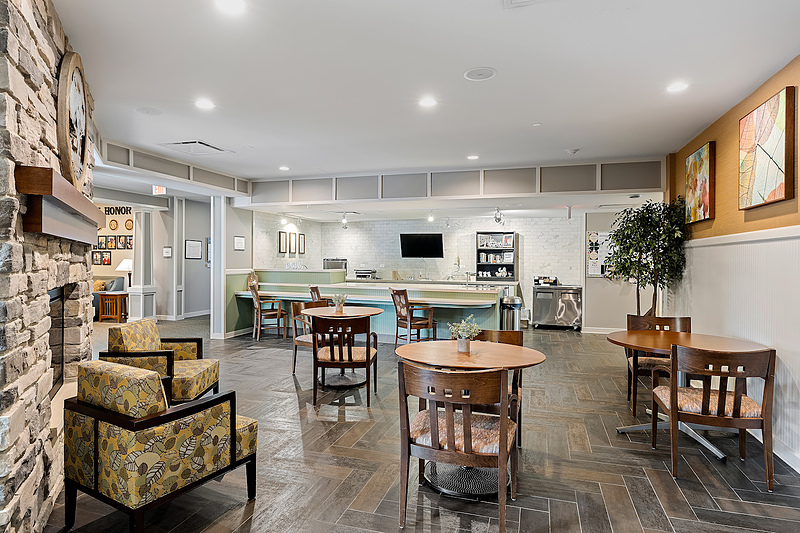 Interior view of a common area with seating and kitchenette