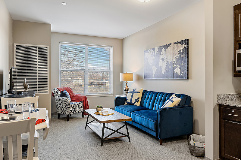 Brightly decorated living room in a senior living unit