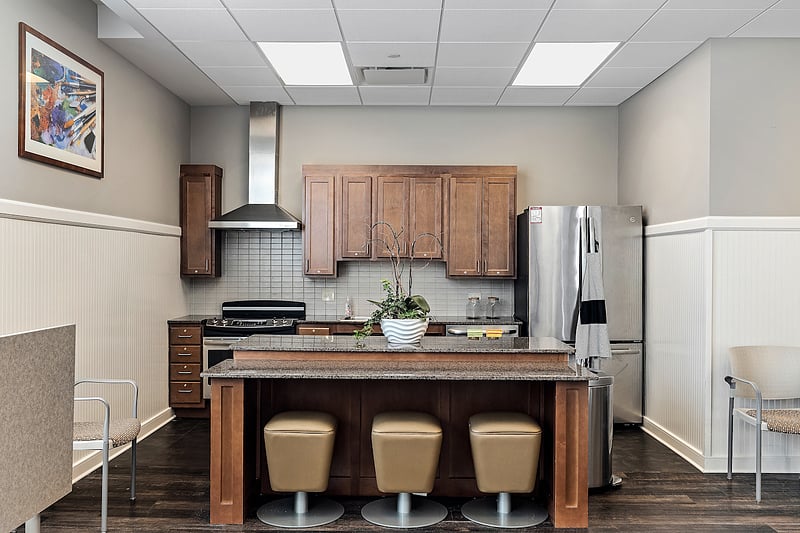 Interior view of a community kitchen area with seating
