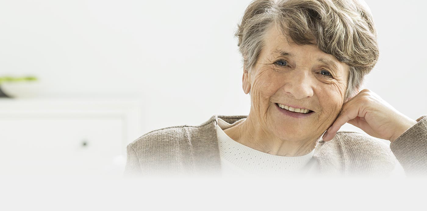 Smiling elderly woman looking at the camera