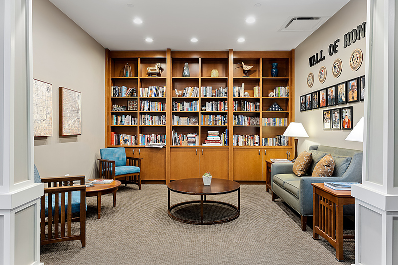 Common area with bookshelves and seating