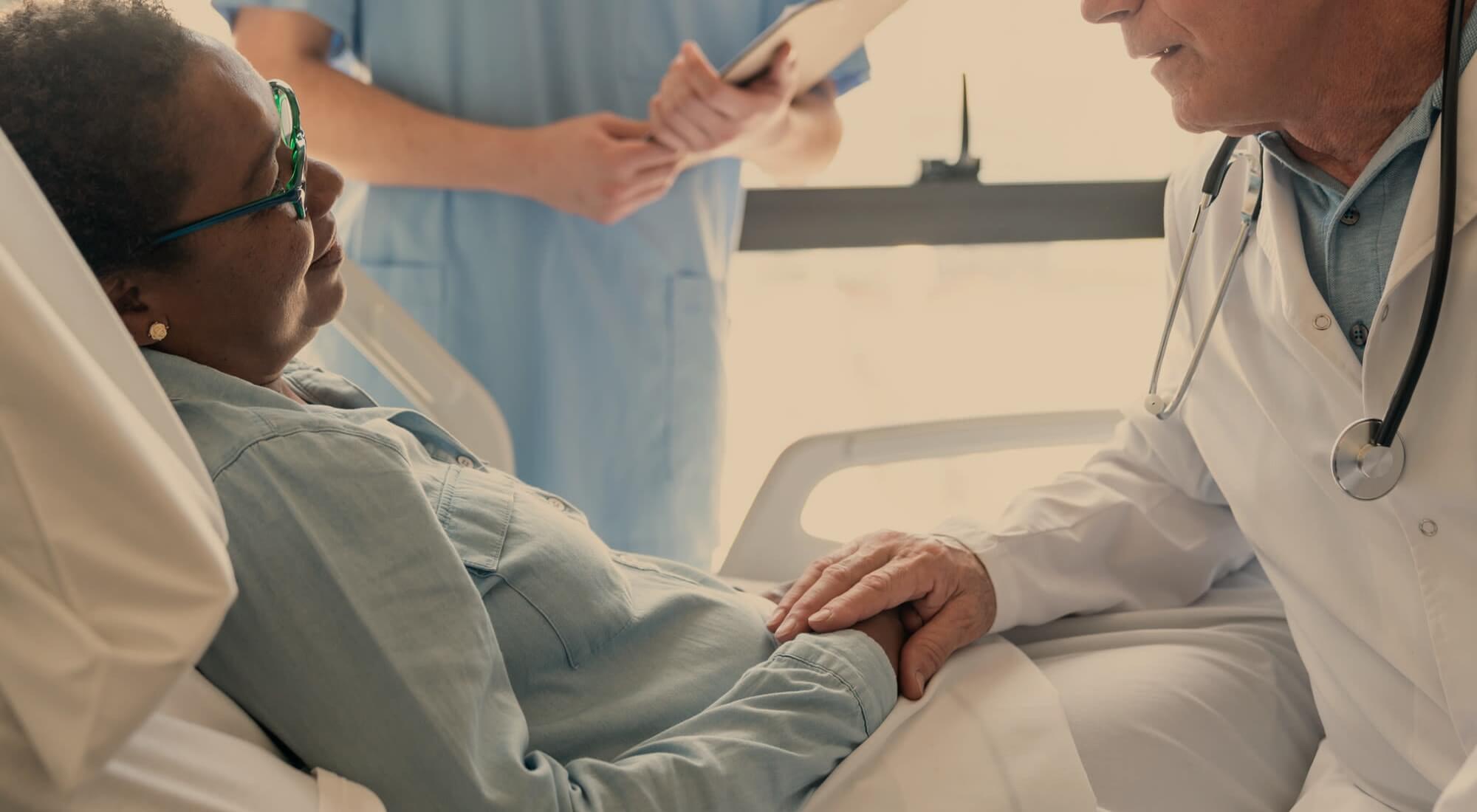 A doctor consulting with a resident in a care facility