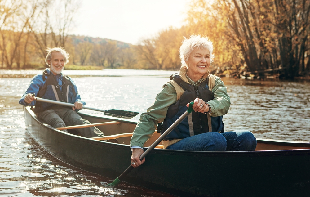 Residents kayaking on a scenic river