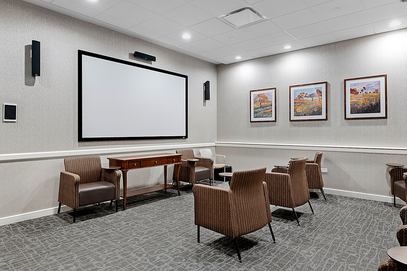 Interior view of a common area with chairs and artwork