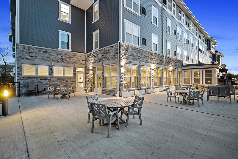 Outdoor seating area of the facility with tables and chairs