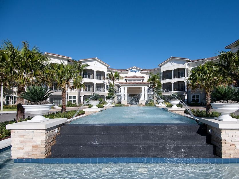 Exterior view of the facility with a water feature