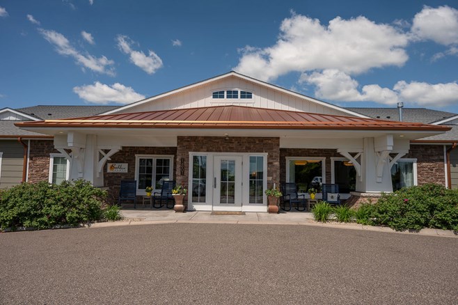 Exterior view of a senior living facility with a welcoming entrance