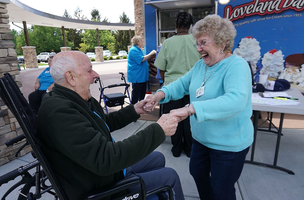 Residents enjoying ice cream outside in a joyful moment